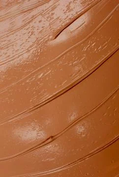 Texture of dark brown concealer Stock Photos