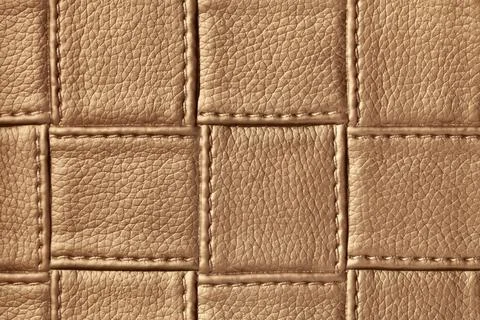 Texture of dark brown leather background with square pattern and stitch, macr Stock Photos