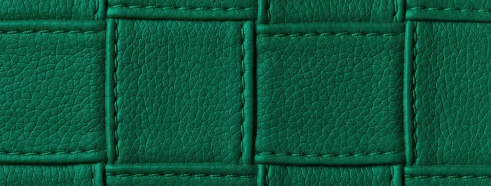 Texture dark emerald leather background with quilted stitched pattern, macro. Illustrazione stock