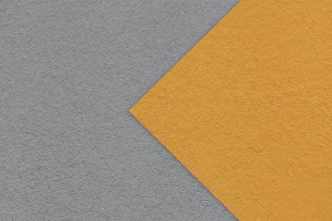 Texture of dark gray paper background, half two colors with orange arrow, mac Stock Photos