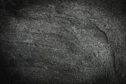 Texture of dark grey stone surface as background, closeup Stockfoto's