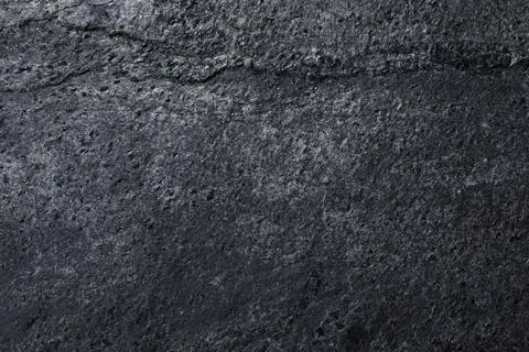 Texture of dark grey stone surface as background, closeup Stock Photos