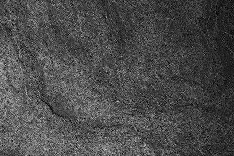 Texture of dark grey stone surface as background, closeup Stock Photos