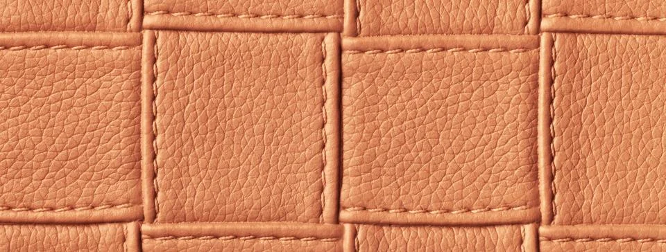 Texture of dark orange and brown leather background with square pattern 스톡 사진