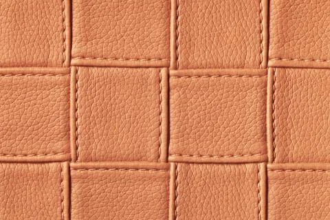 Texture of dark orange and red leather background with square pattern and sti Foto stock