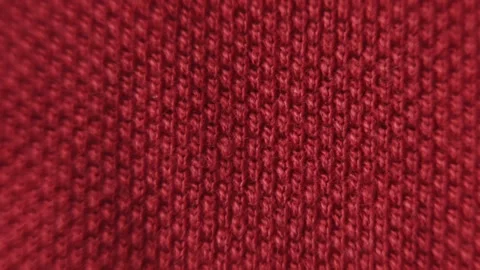 Texture of dark red background from woven textile, moving dynamically, macro Видео 280668565
