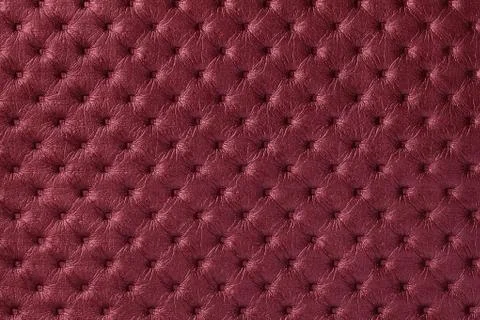 Texture of dark red leather background with capitone pattern, macro. Stock Photos