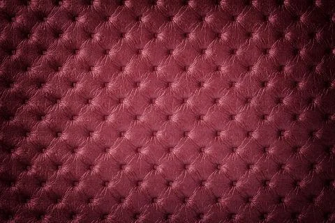 Texture of dark red leather background with capitone pattern with vignette. Stock Photos