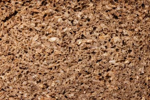 Texture of dark rye whole grain bread crumb close up Stock Photos