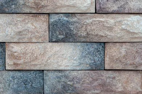 Texture decorative brick wall close-up in daylight Stock Photos