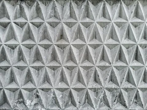 Texture of a decorative concrete wall panel with patterns in the form of embo Stock Photos