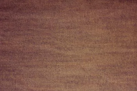 The texture is dense beige cotton. Stock Photos