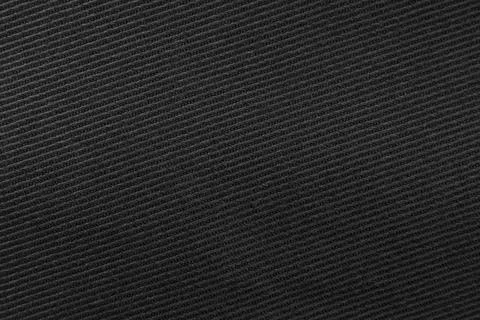 Texture of dense black fabric for tailoring. Canvas. Textile Stock Photos