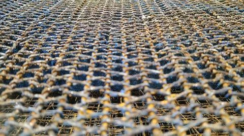 Texture for desktop on computer screen in the form of metal rusty mesh Stock Photos