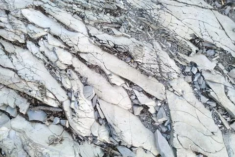The texture of the destroyed stone. The bottom of a dry lake. Stock Photos