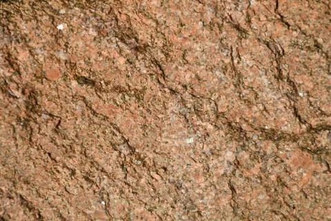 Texture of the destroyed stone, pink granite, small inclusions 스톡 사진