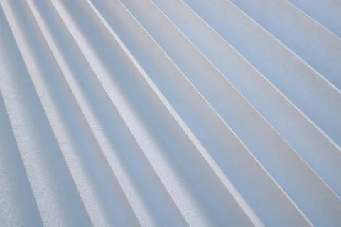 Texture of diagonal stripes with a shadow, with triangular curved ribs, edges Stockfoto's