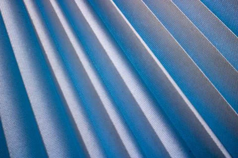 Texture of diagonal stripes with a shadow, with triangular curved ribs, edges Stock Photos