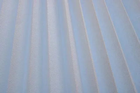 Texture of diagonal stripes with a shadow, with triangular curved ribs, edges 스톡 사진