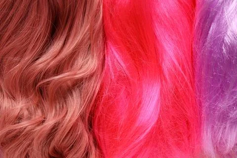 Texture of different beautiful wigs as background, closeup Foto stock