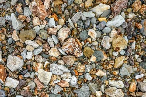 Texture of different sizes of colored stones, Iceland. Stock Photos