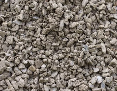 The texture of dirty rubble. Background of small stone covered with mud Stock Photos