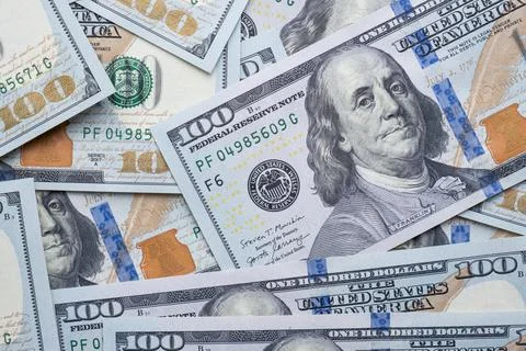 Texture of dollar bills. One hundred dollars. Close-up. Stock Photos