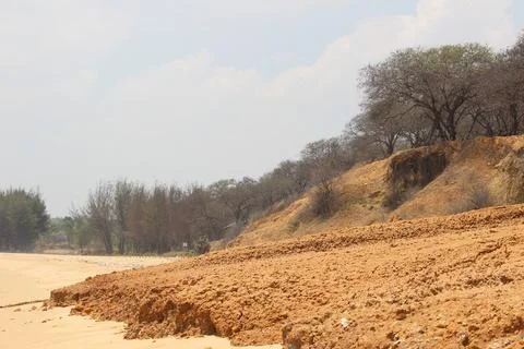 The texture of dry muddy soil is light brown in color Stock Photos