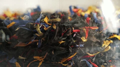 The texture of dry tea leaves with floral additives. Stock Footage 336681630