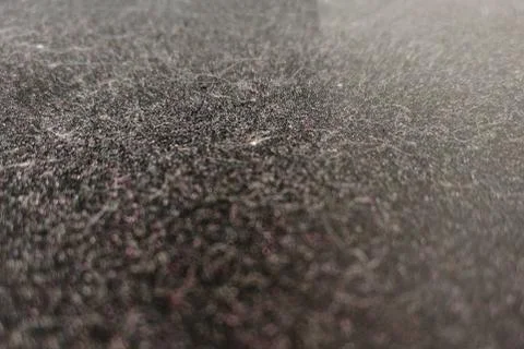 Texture of a dusty surface on a dark background, close-up Stock Photos