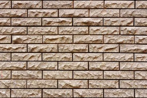 The texture of the embossed facing brick, as the background Fotos Stock