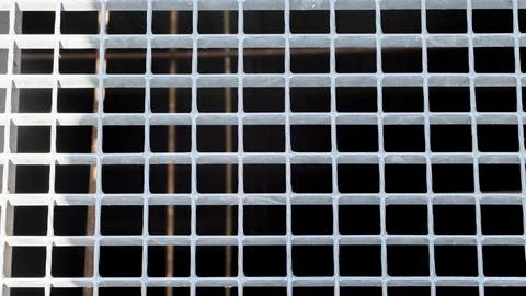 Texture of empty metal squares on a black background Stock Photos