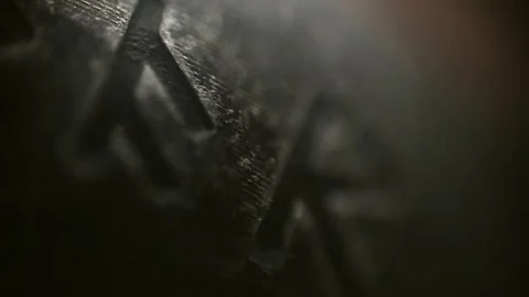 The texture of the engraved runes on a black ring in a close-up macro video Stock Footage 297220277