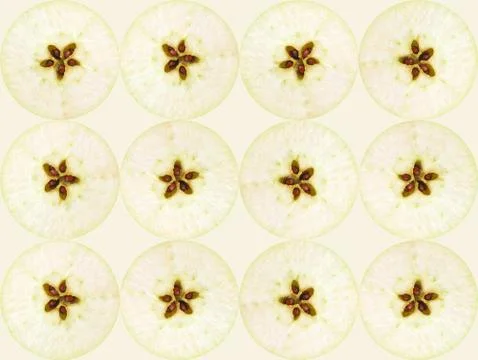 Texture of equatorial cut of a green apples with seeds Stock Photos