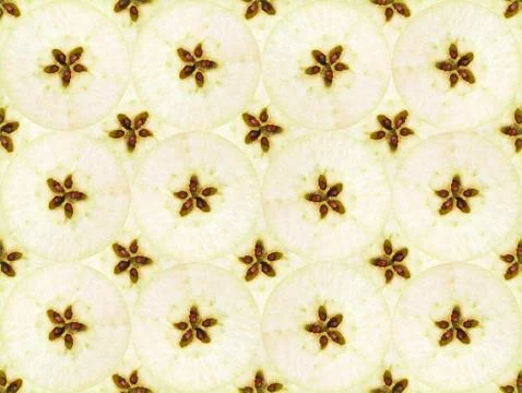 Texture of equatorial cut of a green apples with seeds Stock Photos