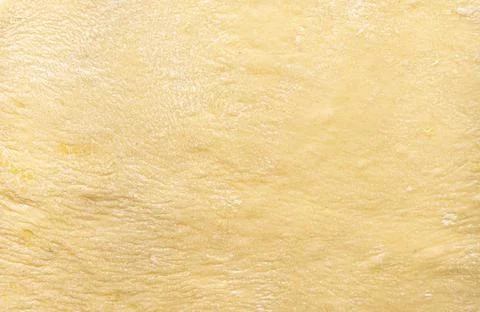 Texture of evenly rolled dough.Background of the dough for baking. Stock Photos