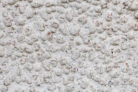 Texture of expanded clay stones and concrete wall Stock Photos