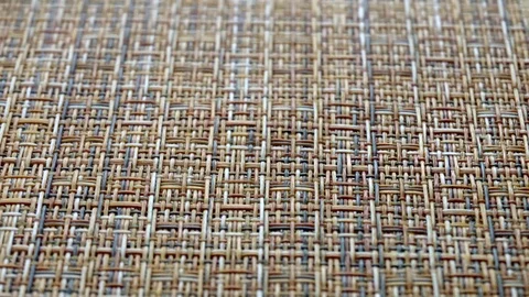 The texture of the fabric. Beige wicker fabric. Close-up. Stockbeeldmateriaal 111563879