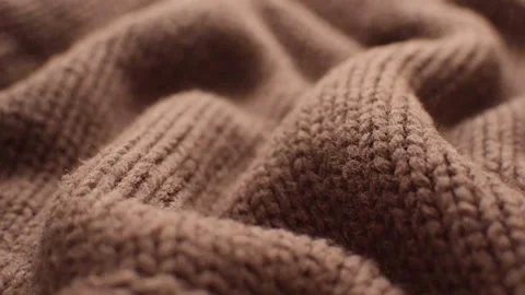 The texture of the fabric. Brown knitted texture. Vídeo Stock 102891179