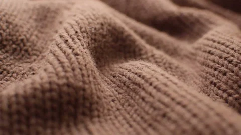 The texture of the fabric. Brown knitted texture. Видео 102891192
