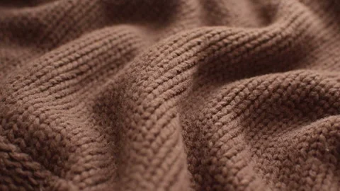 The texture of the fabric. Brown knitted texture. Видео 102891219