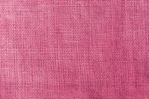 Texture fabric burlap for sewing red background color macro Stockfoto's