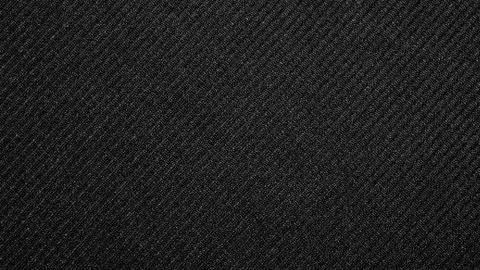 The texture of the fabric is dark gray. Stock Photos
