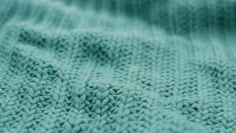 The texture of the fabric. Green knitted texture. Vídeo Stock 102891491
