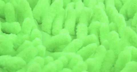 The texture of the fabric. Green knitted texture Stock Footage 114306014
