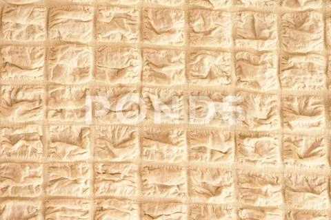 The texture of the fabric, light beige in box Stock Photos