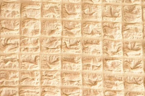 The texture of the fabric, light beige in box Stock Photos
