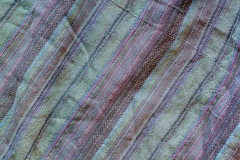 The texture of the fabric with multi-colored stripes on the diagonal. Stock Photos