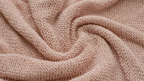 The texture of the fabric. Pink knitted texture. Vídeos de archivo 102891079
