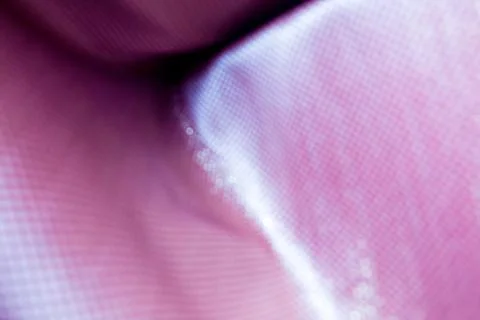 Texture of the fabric, side, background of fabric in the highlight. lilac color Stock Photos